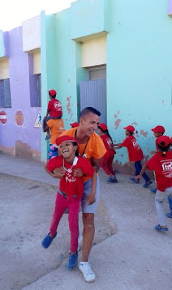 kids and volunteers happy